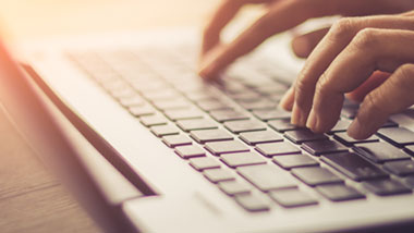 person typing on computer